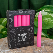 Load image into Gallery viewer, &quot;Pack of Magic Spell Candles in the variation friendship with green foliage in the background,&quot; - Down to Earth.
