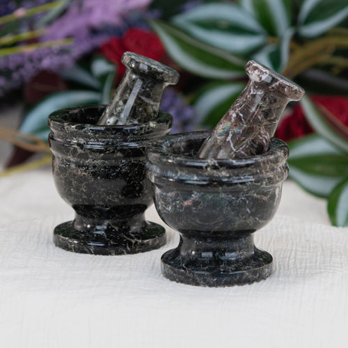 Mortar Pestle Black Zebra 2.5in group picture with a floral background - Down to Earth 