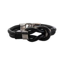 Load image into Gallery viewer, "Black braided leather bracelet with metal clasp on a white background," - Down to Earth.
