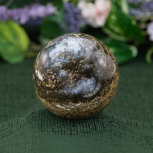Load image into Gallery viewer, Ocean Jasper Sphere on a green background - Down to Earth 
