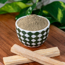 Load image into Gallery viewer, Palo Santo Powder 1lb in a ceramic bowl with palo santo sticks beside lower angle - Down to Earth
