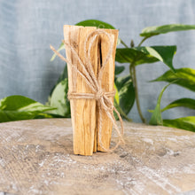 Load image into Gallery viewer, Palo Santo Sticks fronting facing on a style background - Down To Earth
