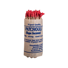 Load image into Gallery viewer, &quot;Patchouli rope incense bundle with red tips wrapped in paper on a white background,&quot; - Down to Earth.
