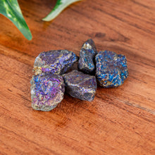 Load image into Gallery viewer, Peacock Ore Raw on a wooden surface high angle - Down to Earth
