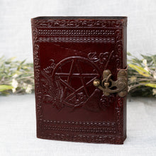Load image into Gallery viewer, Pentagram Leather Journal front facing with plants displayed on a styled background - Down To Earth
