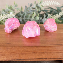 Load image into Gallery viewer, Pink Aura Quartz Point front facing on a style background - Down To Earth
