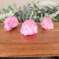 Pink Aura Quartz Point front facing on a style background - Down To Earth