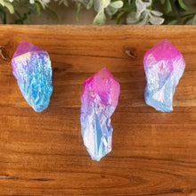 Load image into Gallery viewer, Pink &amp; Blue Aura Quartz Points top down on a style background - Down To Earth

