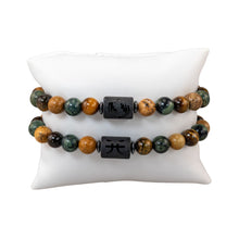 Load image into Gallery viewer, "Two Pisces Zodiac Bracelets on a white pillow," - Down to Earth.
