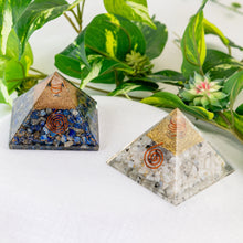 Load image into Gallery viewer, Orgonite Crystal Pyramid group photo on a white surface high angle - Down to Earth
