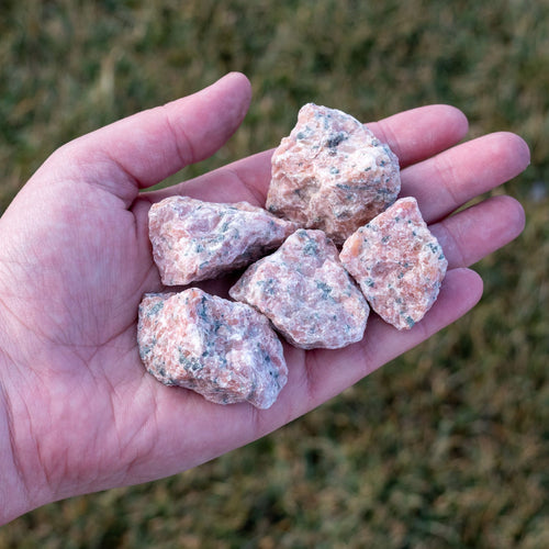 Raw Strawberry Calcite in the Palm of a Hand - Down To Earth