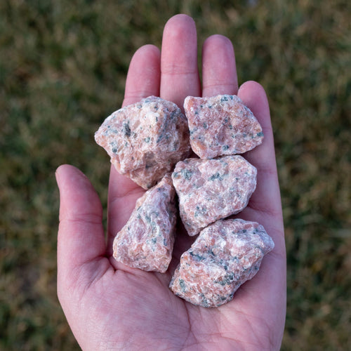 Raw Strawberry Calcite in the Palm of a Hand - Down To Earth