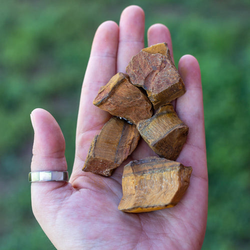 Raw Tigers Eye in the Palm of a Hand - Down to Earth