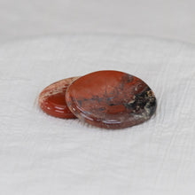 Load image into Gallery viewer, Red Jasper palm stones on a white cloth - Down to Earth 
