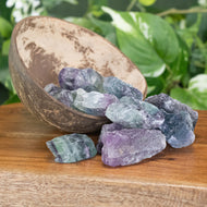 Fluorite Raw 1lb front facing in a bowl displayed on a styled background - Down To Earth