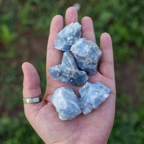 Rough Blue Calcite in the palm of a hand - Down To Earth