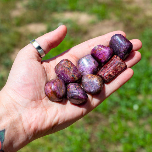 Ruby Tumbled in the palm of a hand - Down To Earth