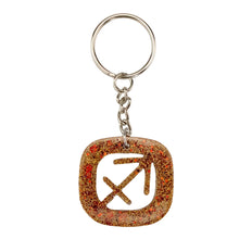 Load image into Gallery viewer, Sagittarius Glitter Resin Keychain on a white background - Down To Earth
