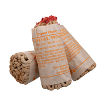 Load image into Gallery viewer, &quot;Sandalwood rope incense wrapped in a paper label on a white background,&quot; - Down to Earth.

