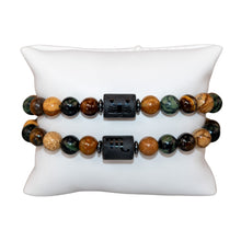 Load image into Gallery viewer, "Two Scorpio Zodiac Bracelets on a white pillow," - Down to Earth.
