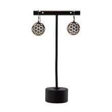 Load image into Gallery viewer, "Black earring stand with a pair of Seed of Life Sterling Silver Earrings on a white background," - Down to Earth.
