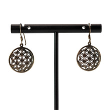 Load image into Gallery viewer, "Pair of Sterling Silver Seed of Life Earrings on a black stand with a white background," - Down to Earth.
