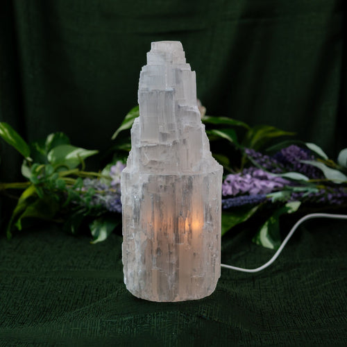 Selenite lit Lamp on a green textured background - Down to Earth