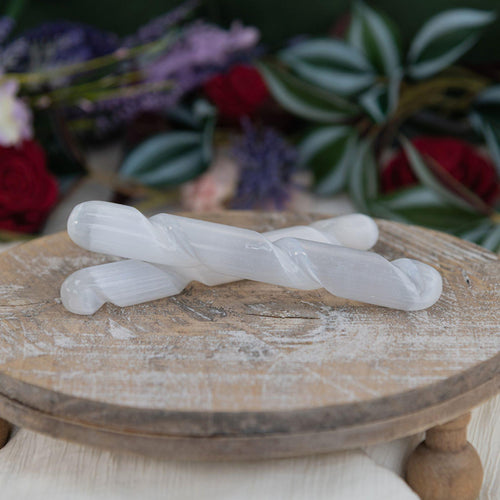 Selenite Spiral Wand in a group photo - Down to Earth 