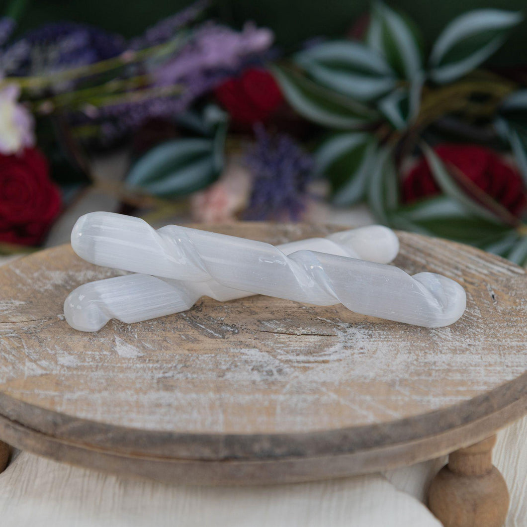 Selenite Spiral Wand in a group photo - Down to Earth 