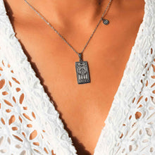 Load image into Gallery viewer, Silver Zodiac Tarot and Astrology Necklace on a Woman - Down To Earth
