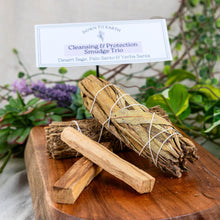 Load image into Gallery viewer, Cleansing &amp; Protection: Desert Sage, Palo Santo &amp; Yerba Santa on a wooden surface styled photo low angle - Down to Earth
