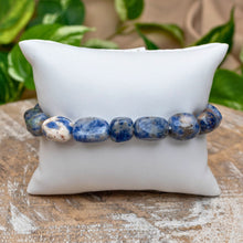 Load image into Gallery viewer, Sodalite Tumbled Stone Bracelet on White Pillow Styled Photo - Down To Earth
