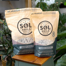 Load image into Gallery viewer, Sol Soils Chunky Perlite group photo with plants displayed on a styled background - Down to Earth
