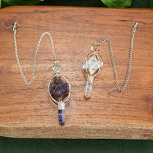 Load image into Gallery viewer, Spinning Merkaba Pendulum top down displayed on a styled background - Down To Earth
