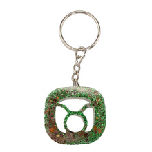 Load image into Gallery viewer, Taurus Glitter Resin Keychain on a white background - Down To Earth
