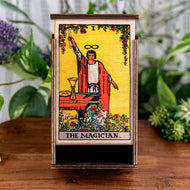 The Magician Slide Box on a wooden surface front facing - Down to Earth
