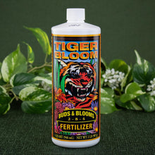 Load image into Gallery viewer, Tiger Bloom Liquid Plant Food with plants displayed on a styled background - Down to Earth
