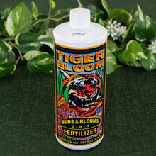 Load image into Gallery viewer, Tiger Bloom Liquid Plant Food top down up close with plants displayed on a styled background - Down to Earth
