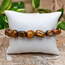 Load image into Gallery viewer, Tiger&#39;s Eye Tumbled Stone Bracelet on White Pillow Styled Photo - Down To Earth
