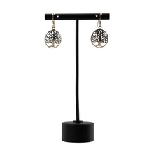 Load image into Gallery viewer, "Tree of life earrings on a black stand against a white background," - Down to Earth.
