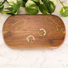 Load image into Gallery viewer, Tree of Life Rose Quartz Gold Necklace group photo on a brown stand on a style background - Down  To Earth
