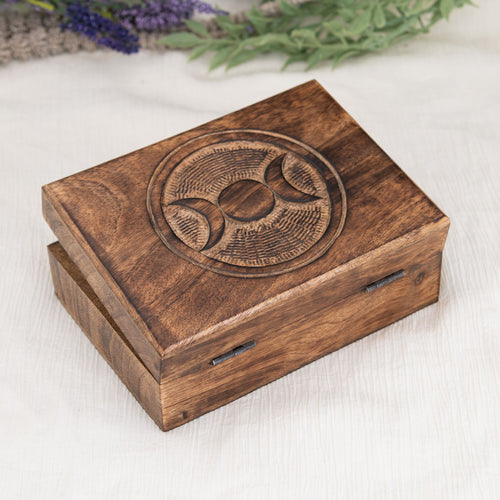 Triple Moon Tarot Card Box on a white surface with lavender in the background - Down to Earth