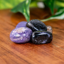 Load image into Gallery viewer, Charoite Tumbled on a wooden surface - Down to Earth
