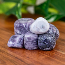 Load image into Gallery viewer, Lepidolite Tumbled on a wooden surface - Down to Earth 
