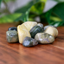 Load image into Gallery viewer, Serpentine Tumbled on a wooden surface - Down to Earth 
