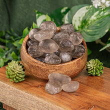 Load image into Gallery viewer, Smoky Quartz Tumbled displayed on a colorful background second angle - Down to Earth
