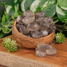 Load image into Gallery viewer, Smoky Quartz Tumbled displayed on a colorful background - Down to Earth
