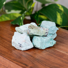 Load image into Gallery viewer, Turquoise Raw on a wooden surface - Down to Earth

