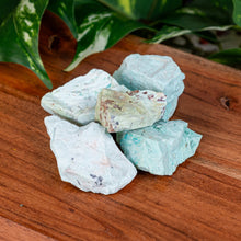 Load image into Gallery viewer, Turquoise Raw on a wooden surface high angle - Down to Earth

