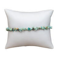 Crystal Chip Bracelet Turquoise on white pillow - Down To Earth